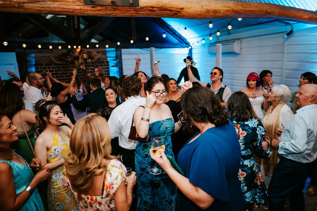 Guests dancing under Sparkulars at a Robertson Public House wedding