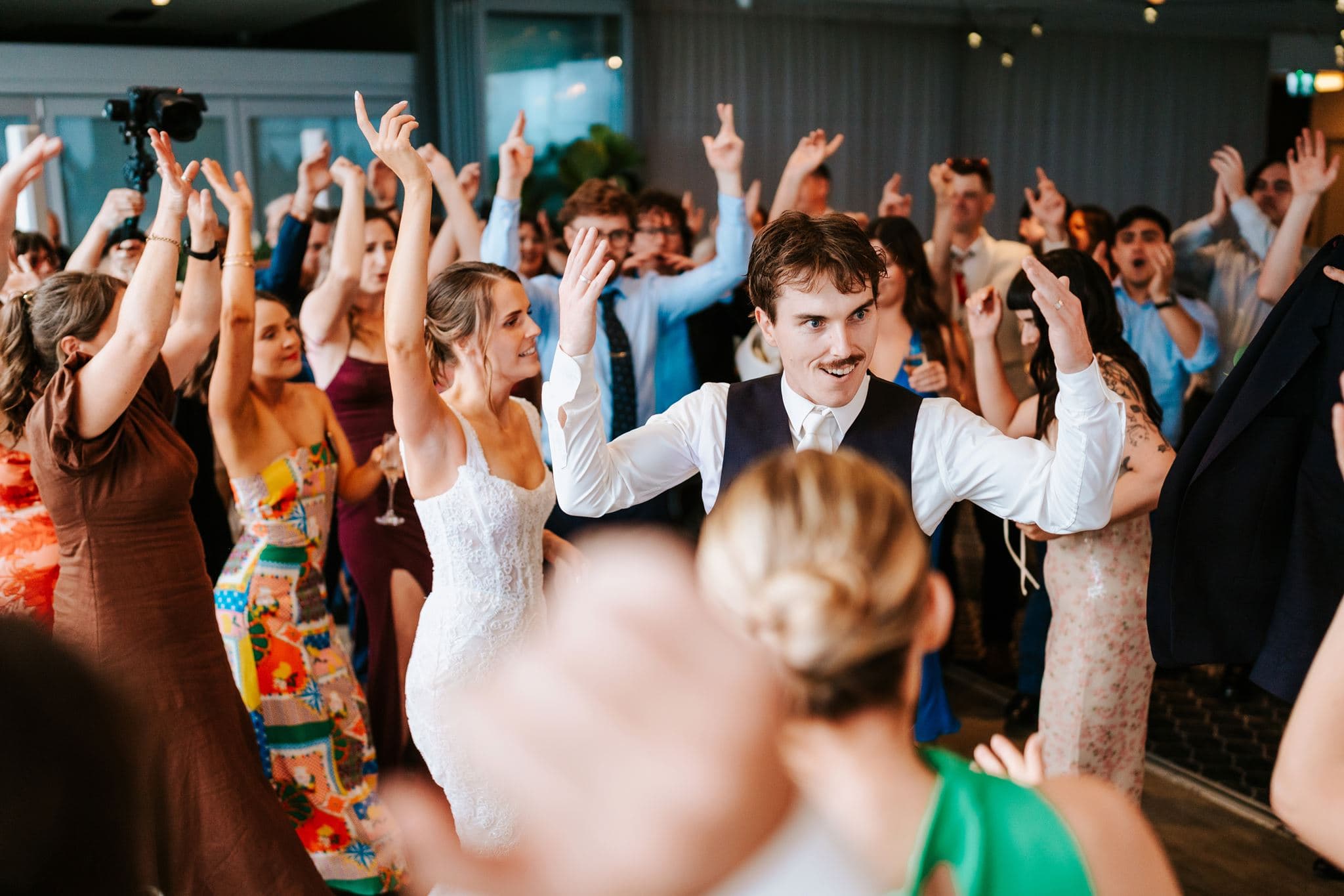 Mandy and Marcus celebrating with their wedding guests