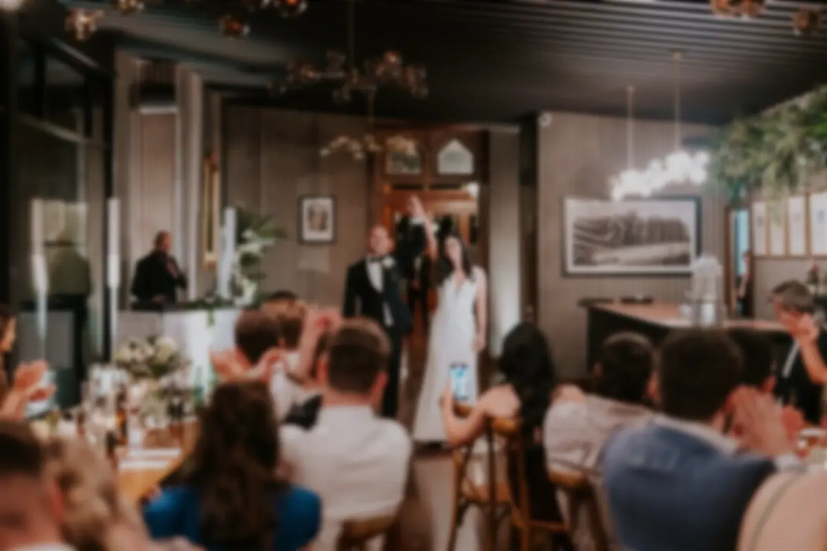 Newlyweds making their entrance into the reception at Kiama Surf Club
