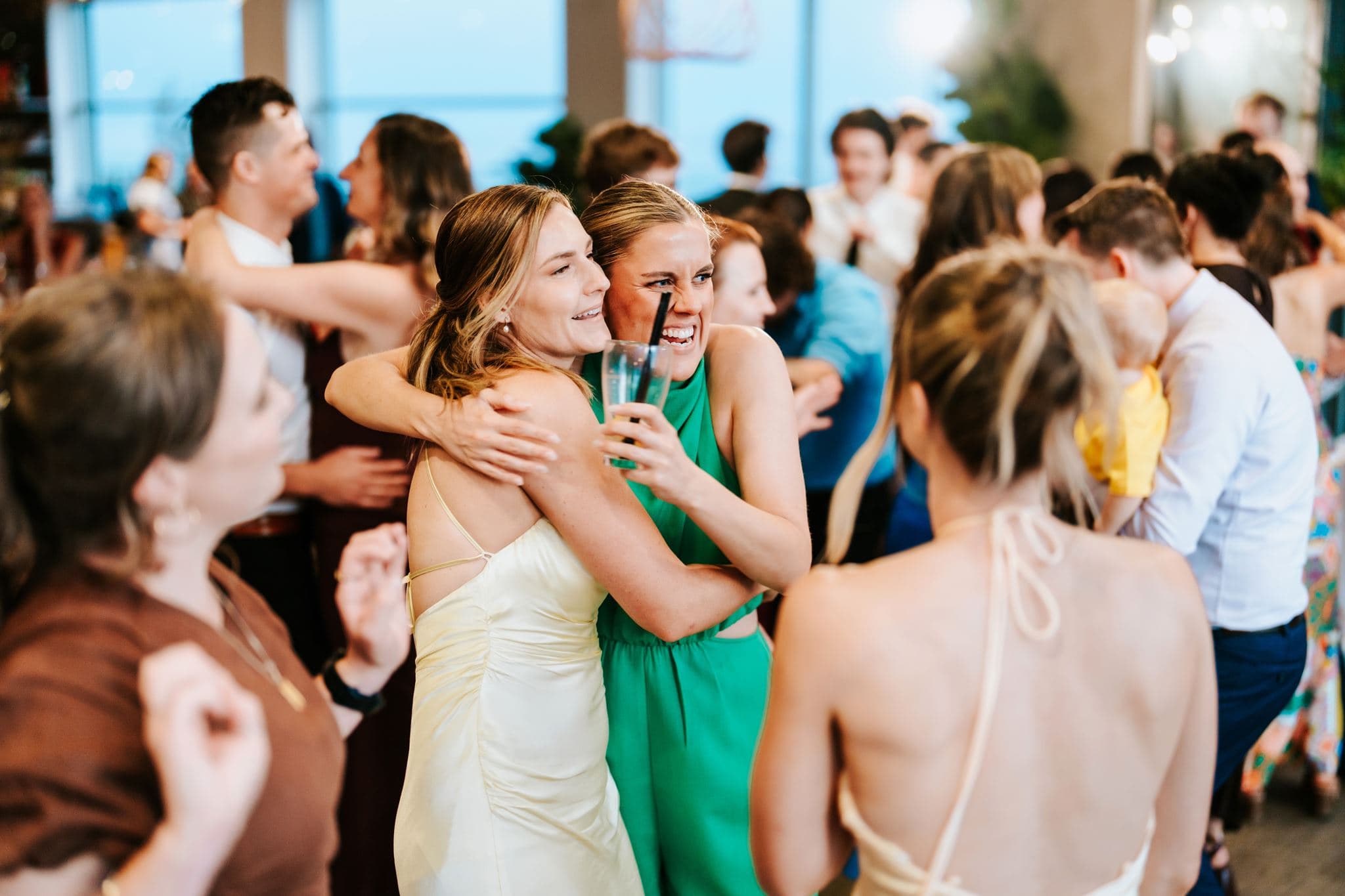 Wedding guests embracing and celebrating together at Headlands Hotel