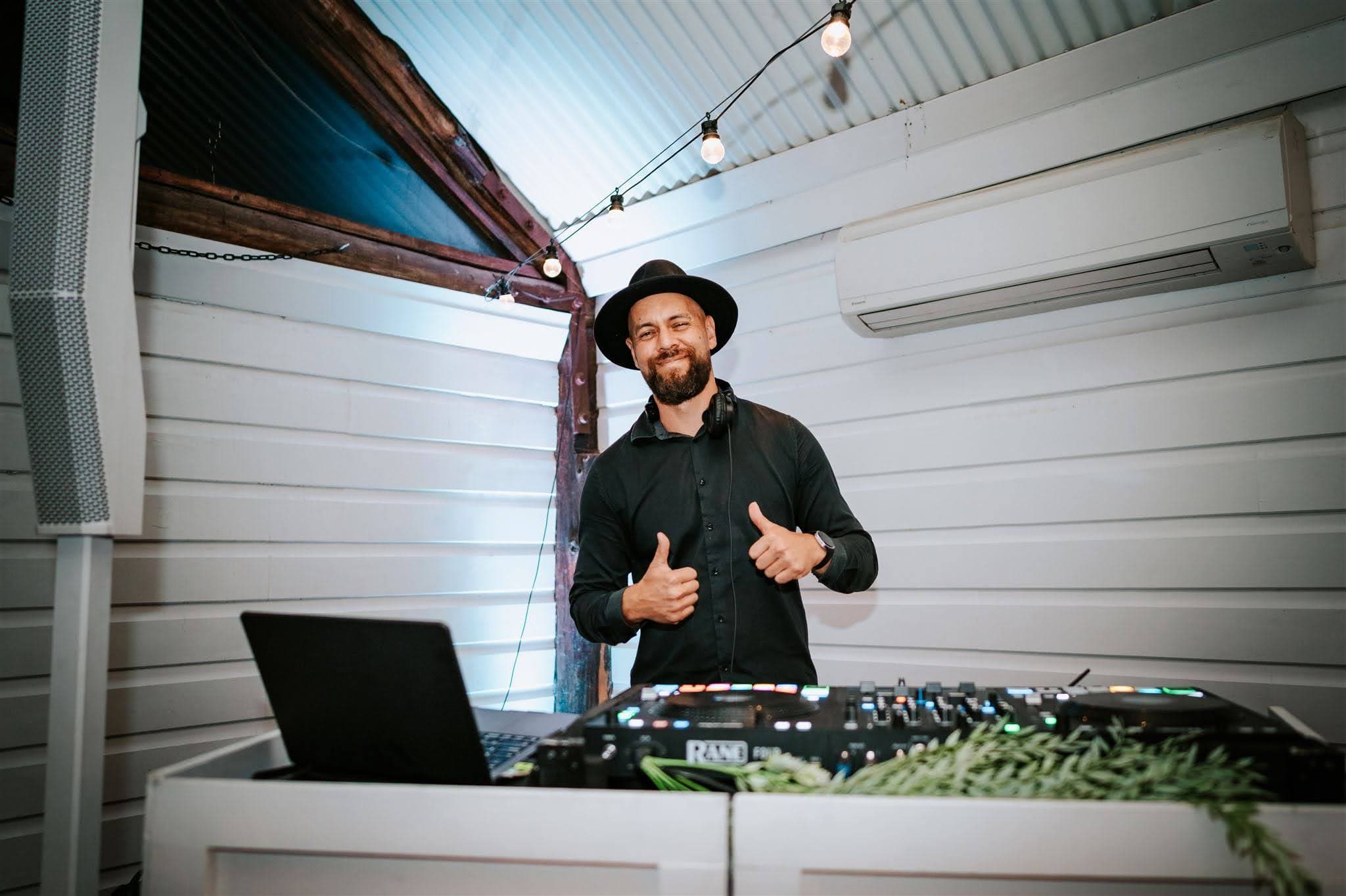 The Ultimate DJs setup at Matt and Dom’s wedding, with the DJ behind the decks at Robertson Public House