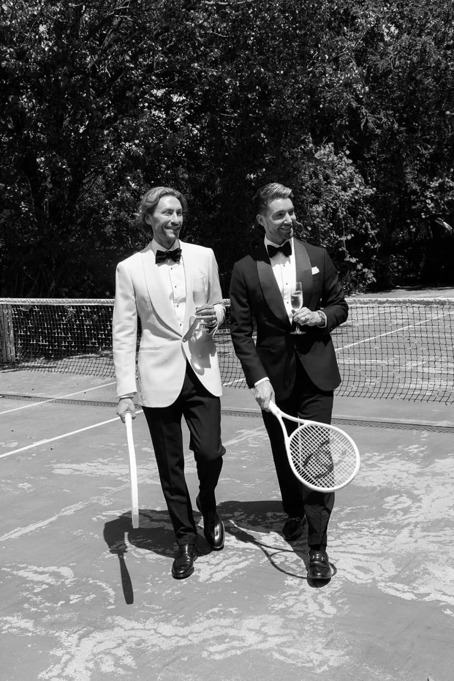 Nathan and Josh in tuxedos on the tennis court at The Merribee