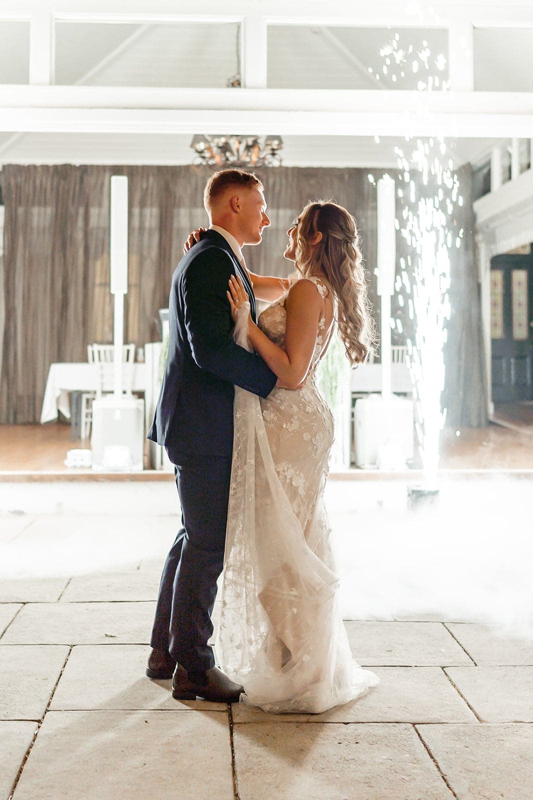 William and Mikayla sharing their first dance with low fog and sparks at Ravensthorpe Estate